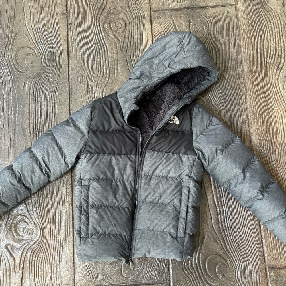 The North Face puffer jacket in size 7/8. 100%poly fill.